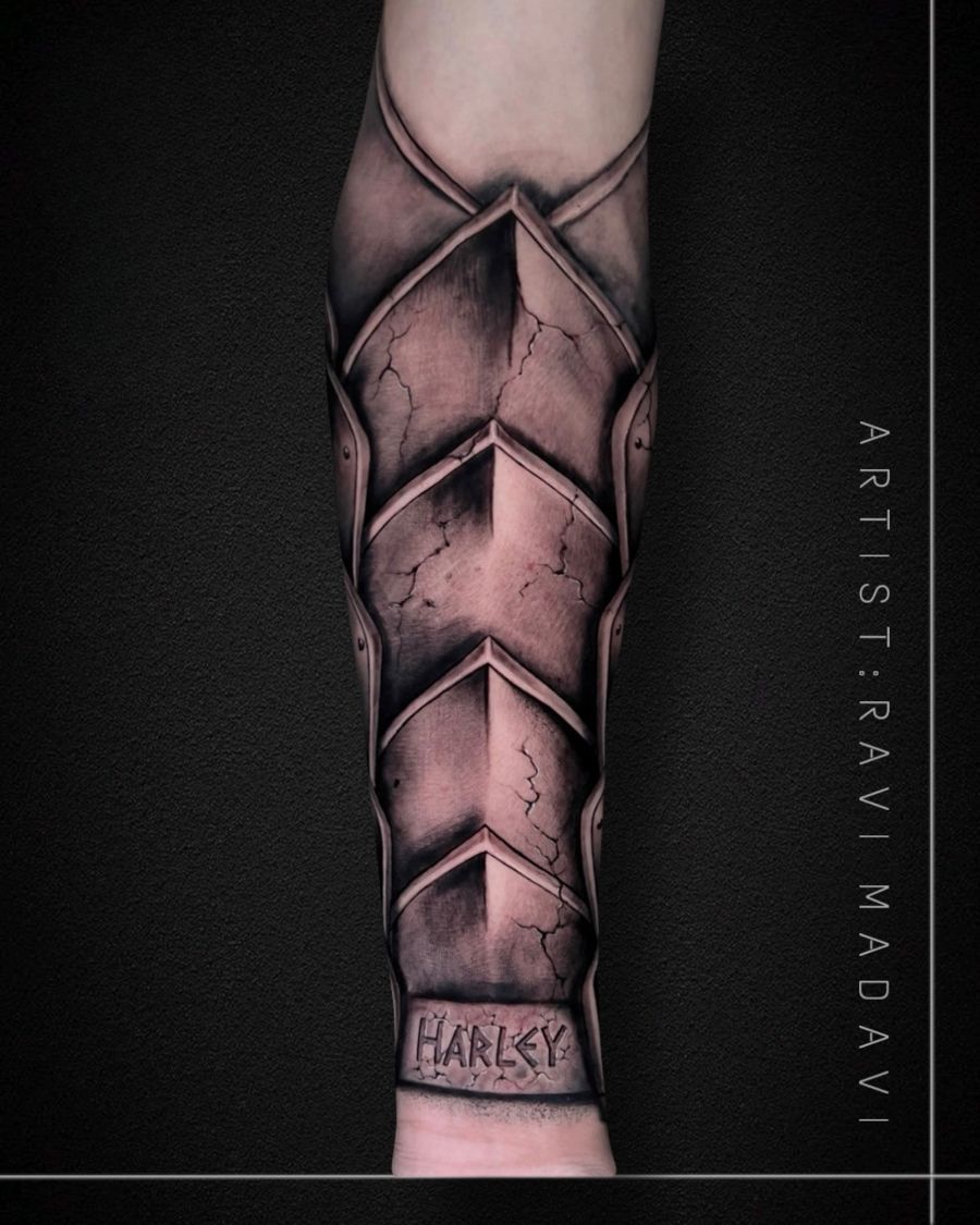 Armour forearm tattoo with lettering