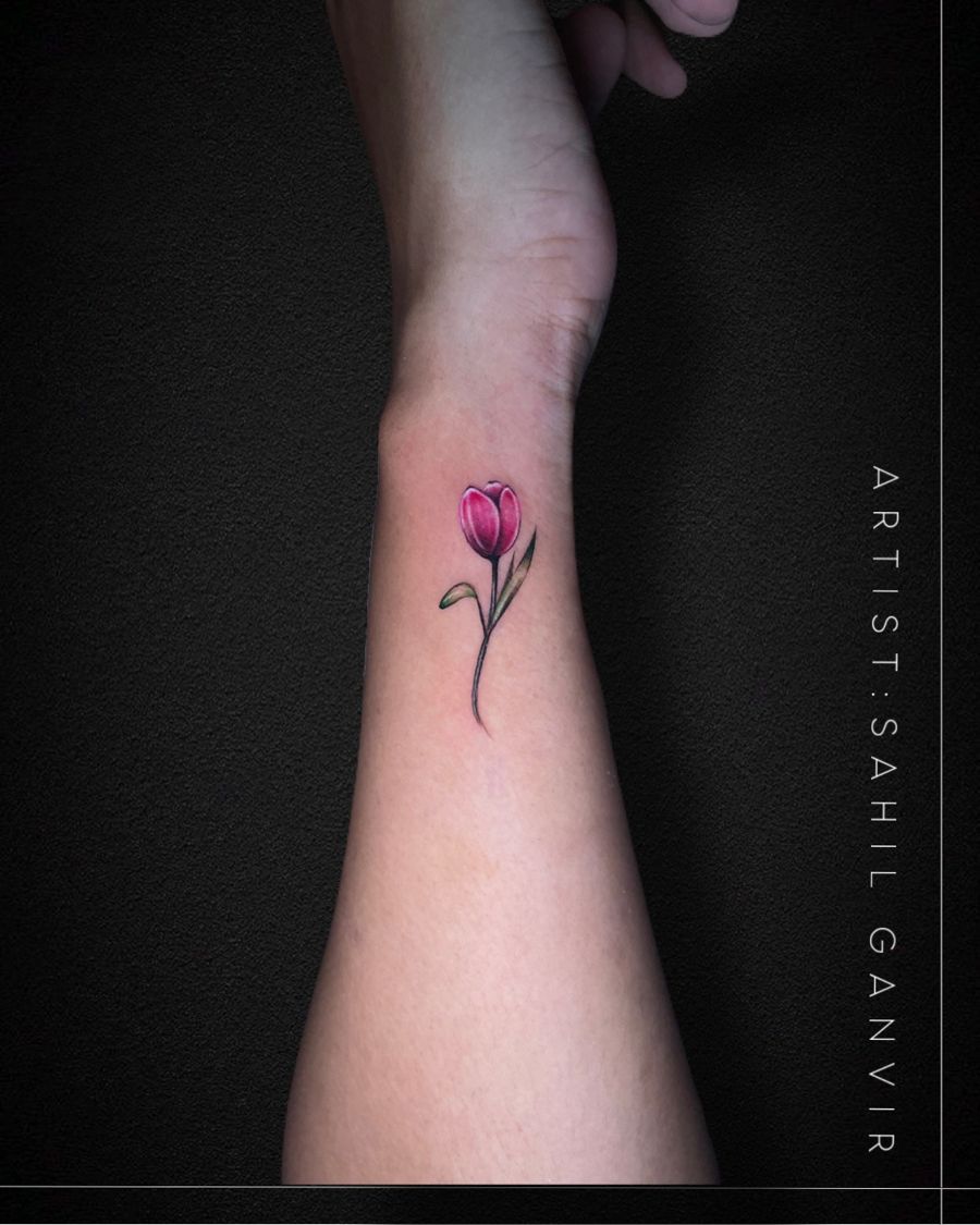 Small fine-line tulip tattoo in colour