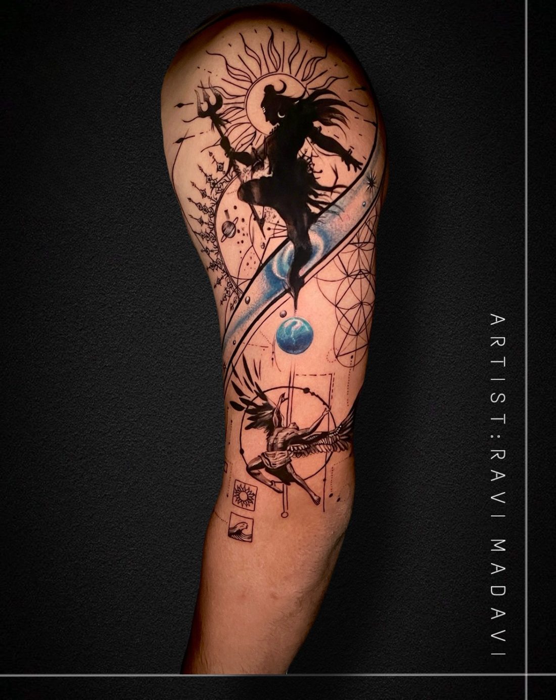 Colour tattoo of Shiva against a blazing sun and the Earth