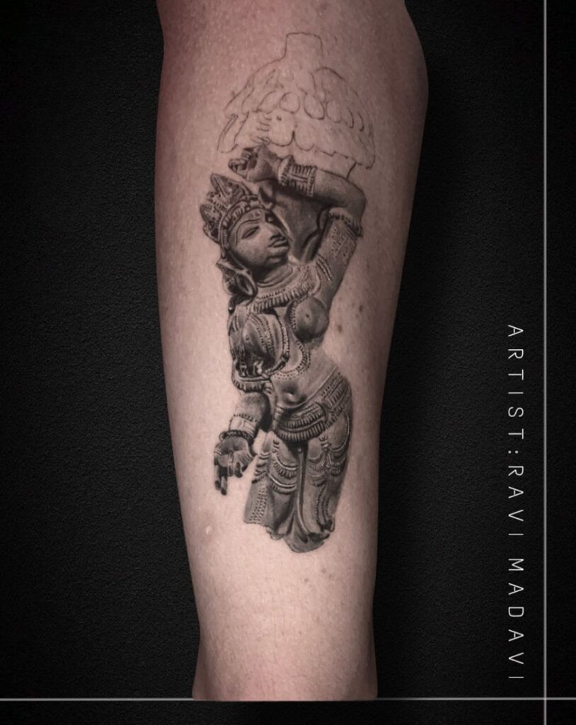 Classical sculpture tattoo in black and grey realism on the forearm