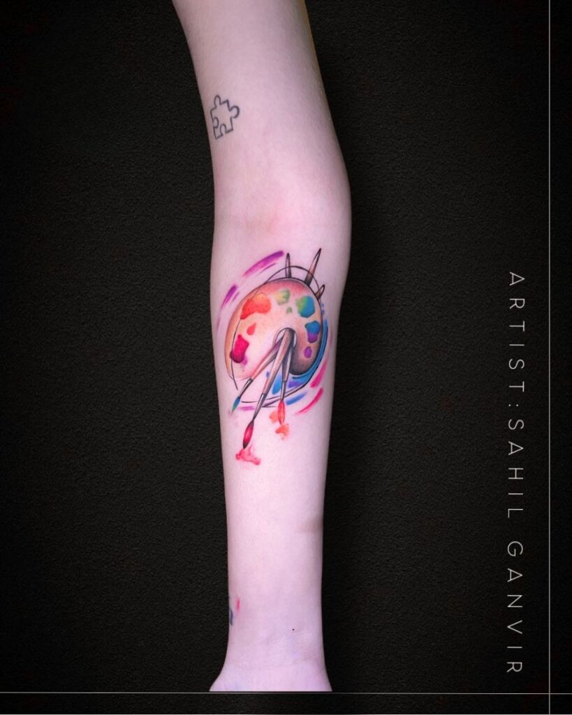 Small watercolour abstract tattoo on the forearm