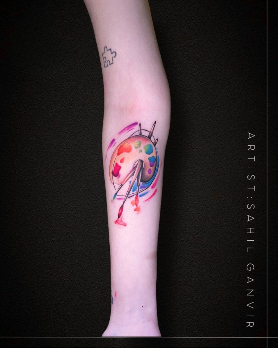 Small watercolour abstract tattoo on the forearm